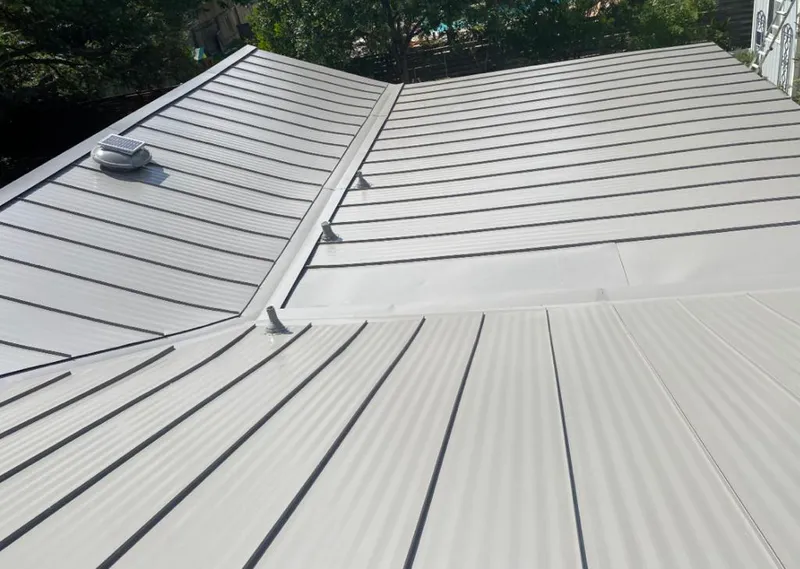 Solar attic fan installed on a metal roof for Roof Ventilation in Zephyrhills South